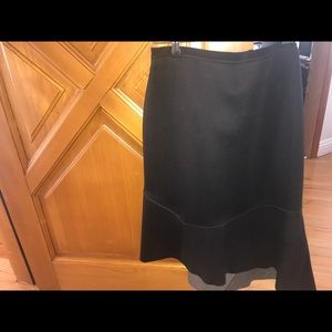 A brand new designer skirt with leather inserts